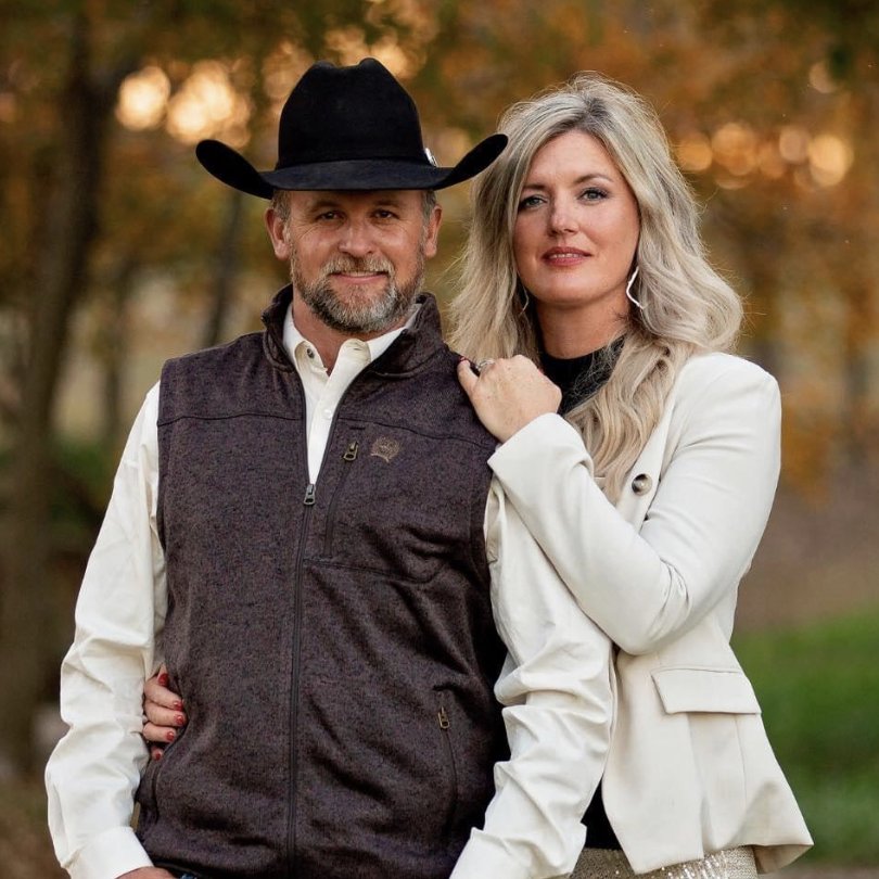 Cade and Jessica Richmond under fall trees