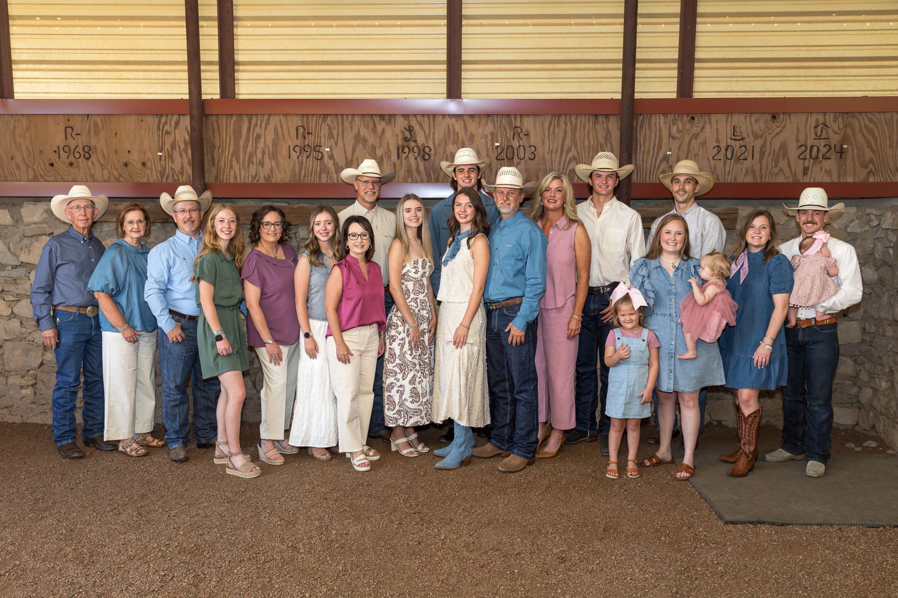 The extended Richmond family in front of the brand wall